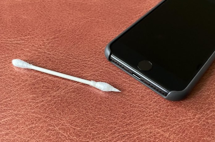 clean the iPhone charging port with cotton